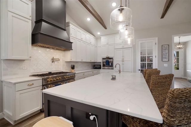 kitchen featuring white cabinetry, custom exhaust hood, stainless steel appliances, and decorative backsplash