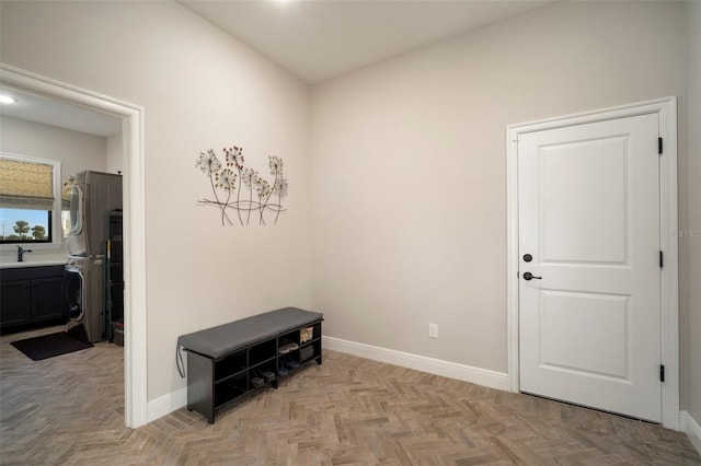 interior space featuring a sink and baseboards