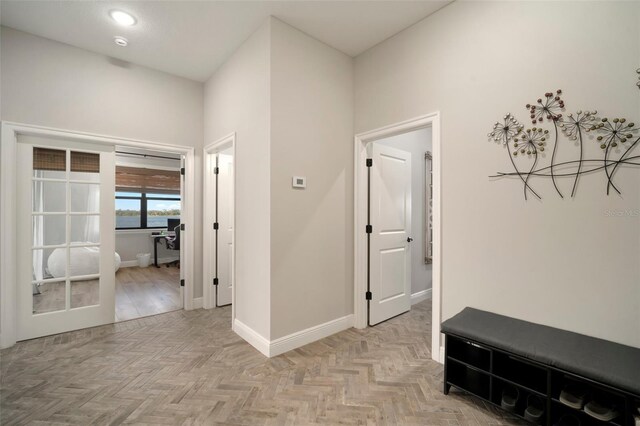 hall featuring baseboards