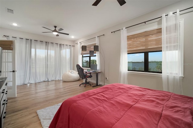 bedroom featuring ceiling fan, visible vents, wood finished floors, and recessed lighting