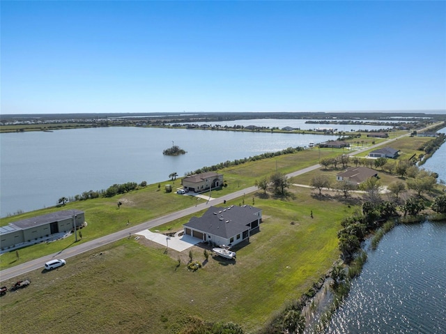 drone / aerial view with a water view