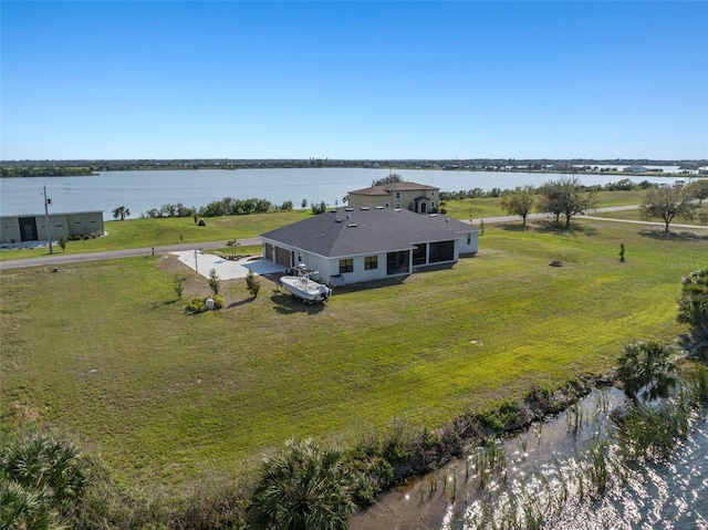 drone / aerial view with a water view