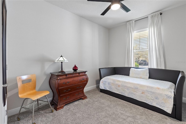 bedroom featuring carpet floors, baseboards, and a ceiling fan