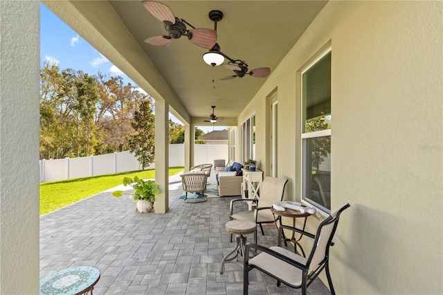 view of patio with a ceiling fan and a fenced backyard