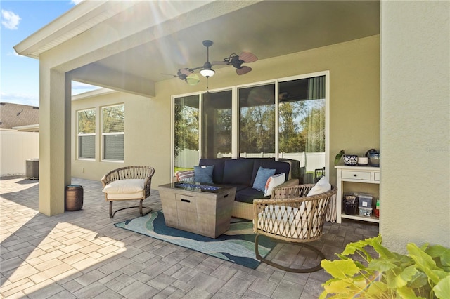 view of patio / terrace featuring ceiling fan, central AC unit, outdoor lounge area, and fence