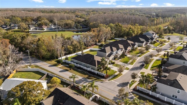 aerial view featuring a residential view and a forest view