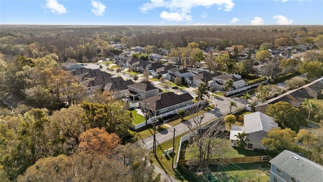 bird's eye view featuring a forest view and a residential view