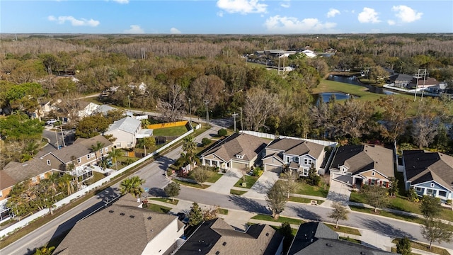 birds eye view of property with a water view and a residential view