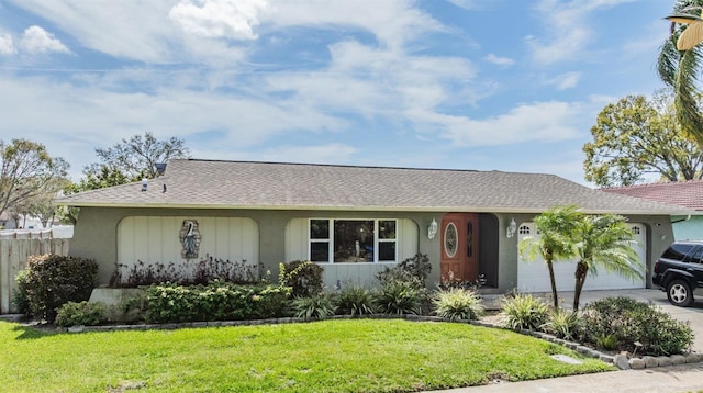 single story home with driveway, a garage, fence, and a front lawn