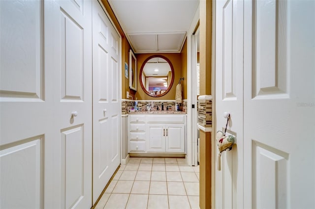 interior space featuring vanity and tile patterned floors