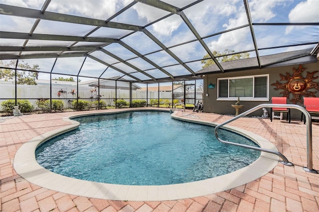 view of pool featuring a fenced in pool, glass enclosure, a patio area, and fence