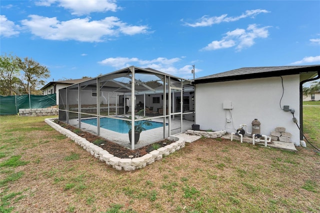 4118 Ramona Dr, Spring Hill, FL 34606 - rear view of house with an outdoor pool, stucco siding, a patio area, and glass enclosure