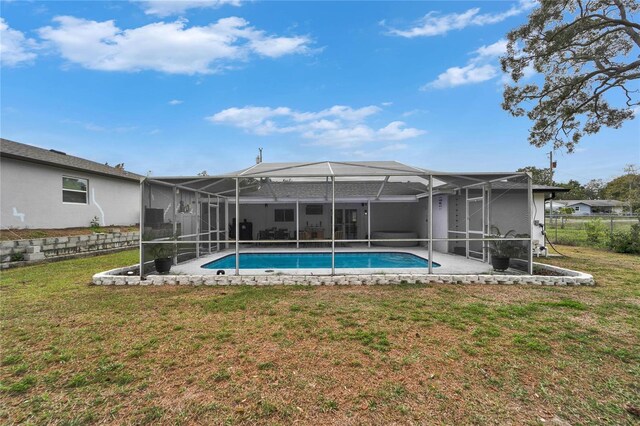 4118 Ramona Dr, Spring Hill, FL 34606 - rear view of house featuring a lawn, an outdoor pool, and a lanai