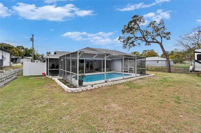 4118 Ramona Dr, Spring Hill, FL 34606 - back of property with a fenced backyard, an outdoor pool, glass enclosure, and a patio area