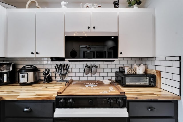 4118 Ramona Dr, Spring Hill, FL 34606 - kitchen with butcher block counters, white cabinetry, tasteful backsplash, and black / electric stove
