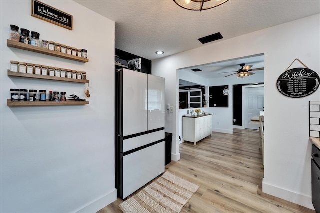 4118 Ramona Dr, Spring Hill, FL 34606 - kitchen featuring light wood-type flooring, a ceiling fan, and a textured ceiling