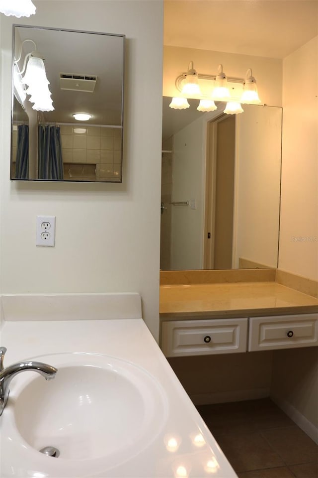 bathroom with vanity and tile patterned flooring