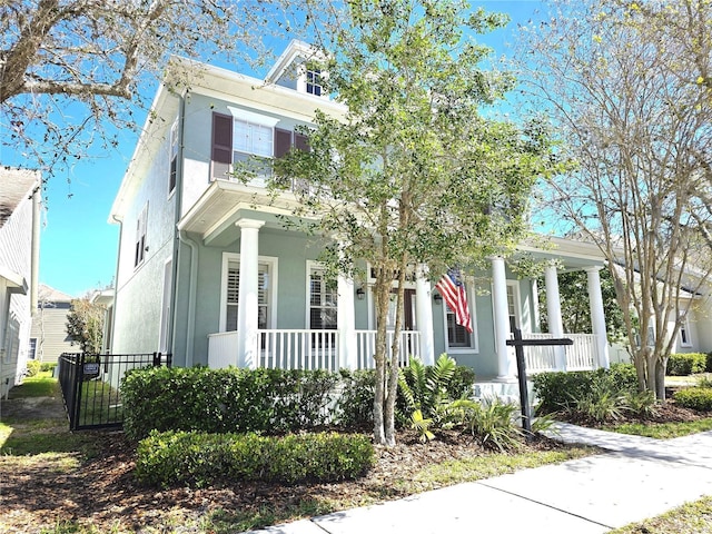 view of front facade featuring a porch and stucco siding