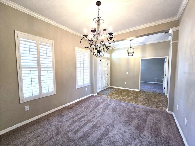 carpeted empty room with baseboards, a chandelier, and crown molding