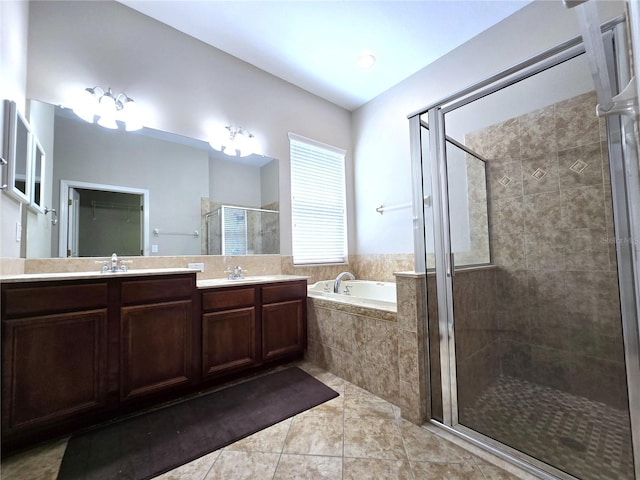 full bath featuring a garden tub, double vanity, a stall shower, a sink, and tile patterned floors