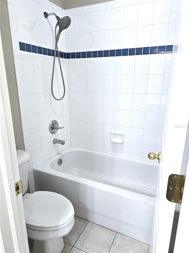 full bathroom featuring tub / shower combination, toilet, and tile patterned floors