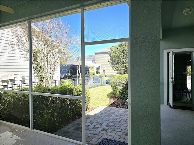 doorway to outside with a textured wall