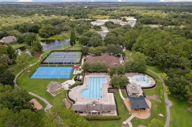 bird's eye view with a water view and a view of trees