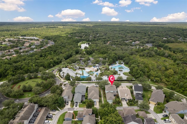 bird's eye view with a wooded view and a residential view