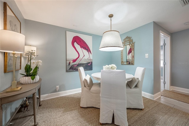 dining space with visible vents and baseboards