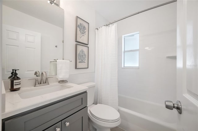 bathroom featuring shower / tub combo with curtain, vanity, and toilet