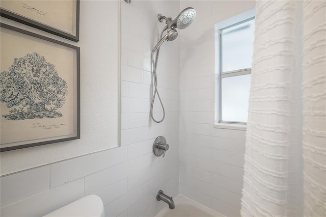 full bathroom with toilet and tub / shower combination