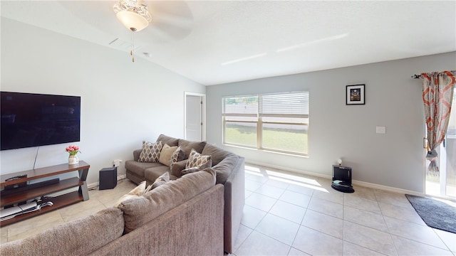 10115 Paradise Fish Dr, Riverview, FL 33578 - living room featuring light tile patterned floors, baseboards, ceiling fan, and vaulted ceiling