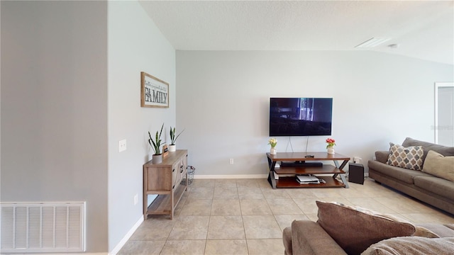 10115 Paradise Fish Dr, Riverview, FL 33578 - living area featuring vaulted ceiling, light tile patterned floors, baseboards, and visible vents