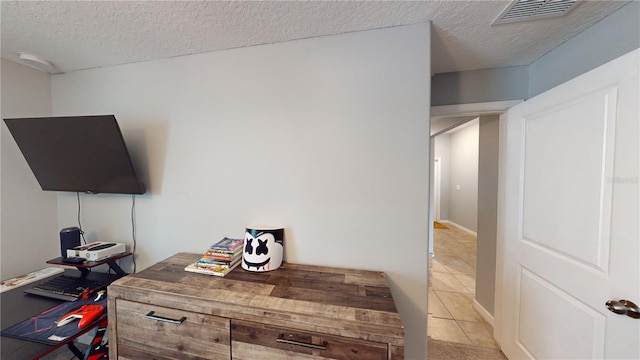 10115 Paradise Fish Dr, Riverview, FL 33578 - interior space with light tile patterned floors, visible vents, and a textured ceiling