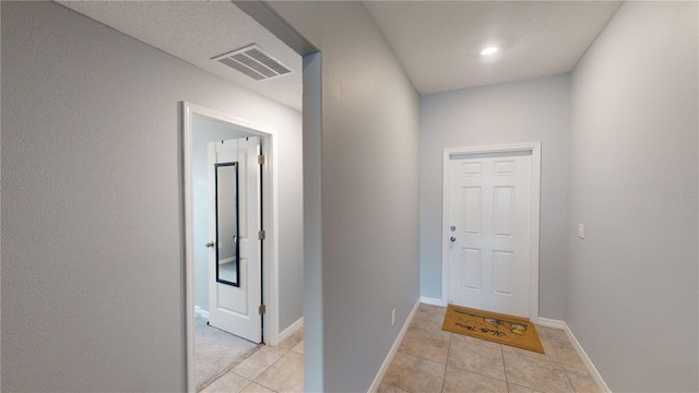 10115 Paradise Fish Dr, Riverview, FL 33578 - hallway featuring light tile patterned floors, baseboards, and visible vents