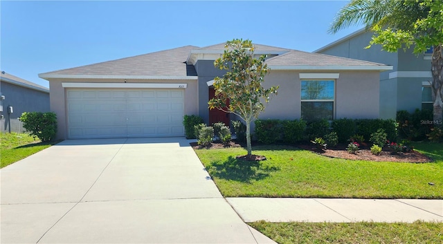 10115 Paradise Fish Dr, Riverview, FL 33578 - single story home with a front lawn, an attached garage, concrete driveway, and stucco siding