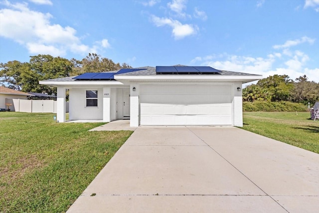 view of front of home featuring driveway, a garage, a front lawn, and stucco siding