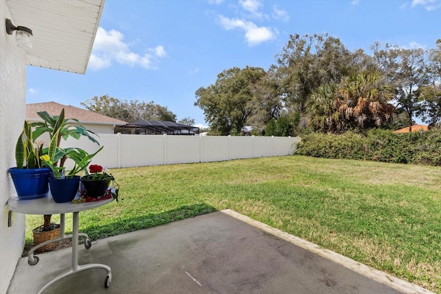 view of yard featuring a patio and fence