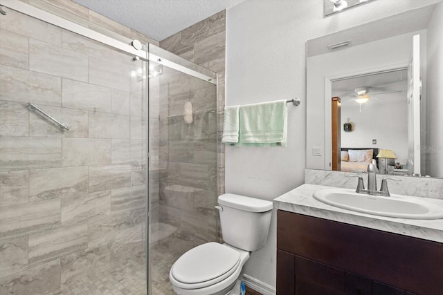 ensuite bathroom with visible vents, toilet, ensuite bathroom, vanity, and a shower stall