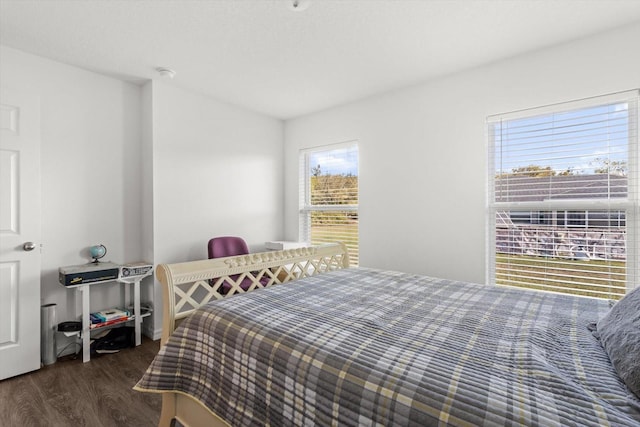 bedroom with wood finished floors