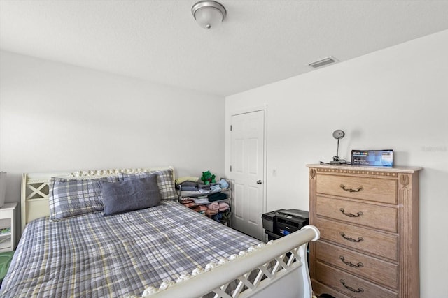 bedroom with visible vents