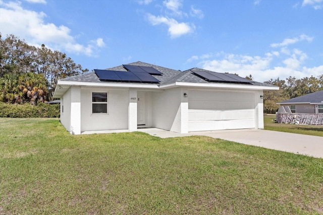 view of front of house with a garage, driveway, a front lawn, and stucco siding