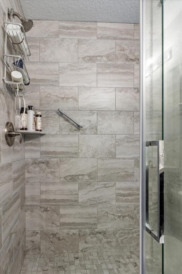 bathroom featuring a shower stall