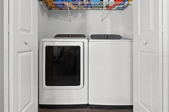 washroom featuring laundry area and washer and dryer