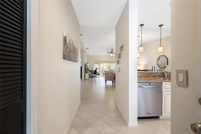 corridor featuring baseboards