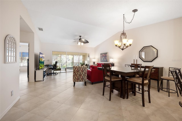 dining room with visible vents, baseboards, lofted ceiling, ceiling fan with notable chandelier, and light tile patterned flooring