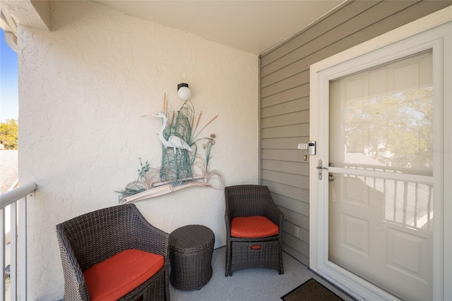 property entrance with stucco siding