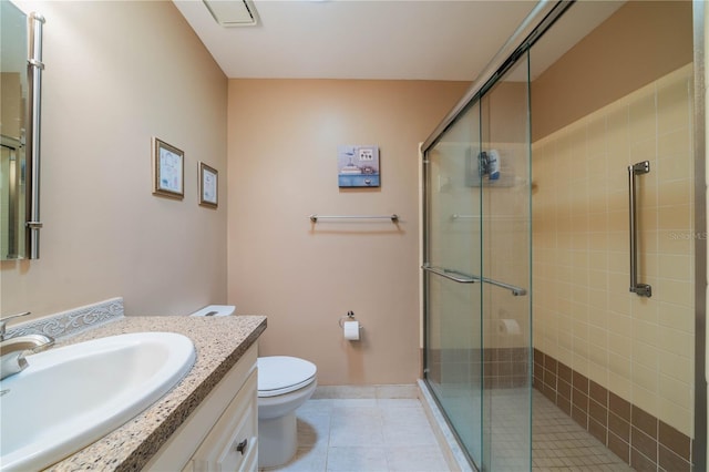 full bath with tile patterned floors, vanity, a shower stall, and toilet