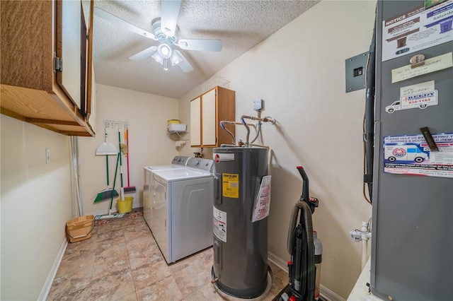 laundry area with a ceiling fan, a textured ceiling, water heater, cabinet space, and washing machine and clothes dryer