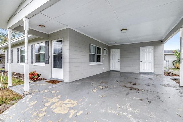 exterior space with a carport